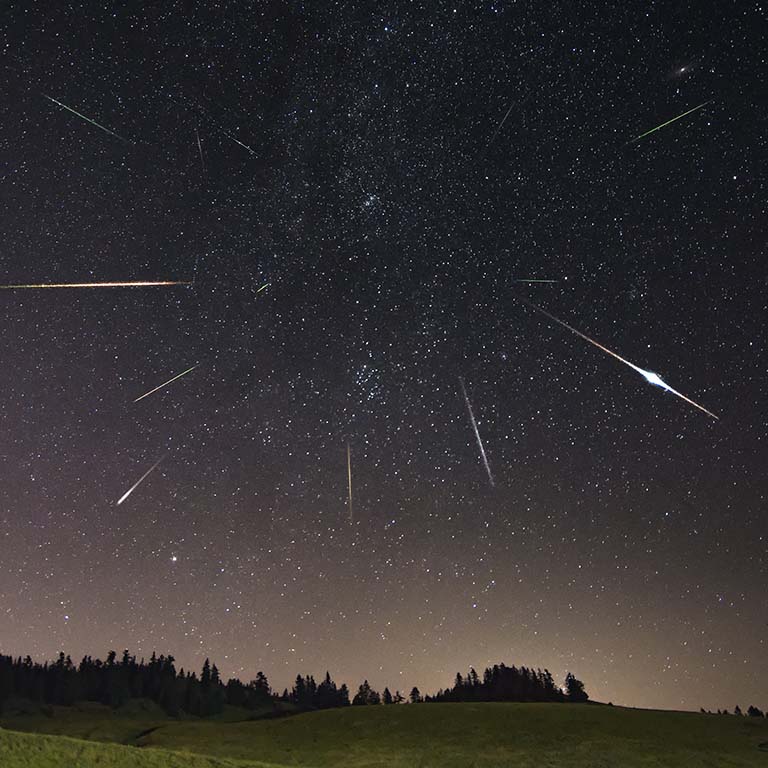 Perseid meteor shower with farm building